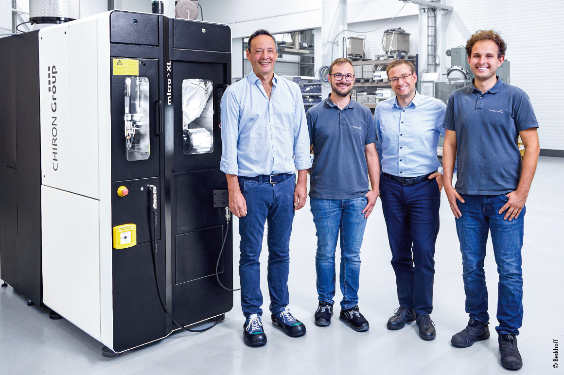 Dieter Völkle (Sales, Beckhoff branch in Balingen) with Tobias Widinger, Micro5 XL System Engineer, Senior Product Manager Michael Wurster, and Development Engineer Jan Steppacher (all Chiron Group SE) in front of the 5-axis CNC (from left to right).