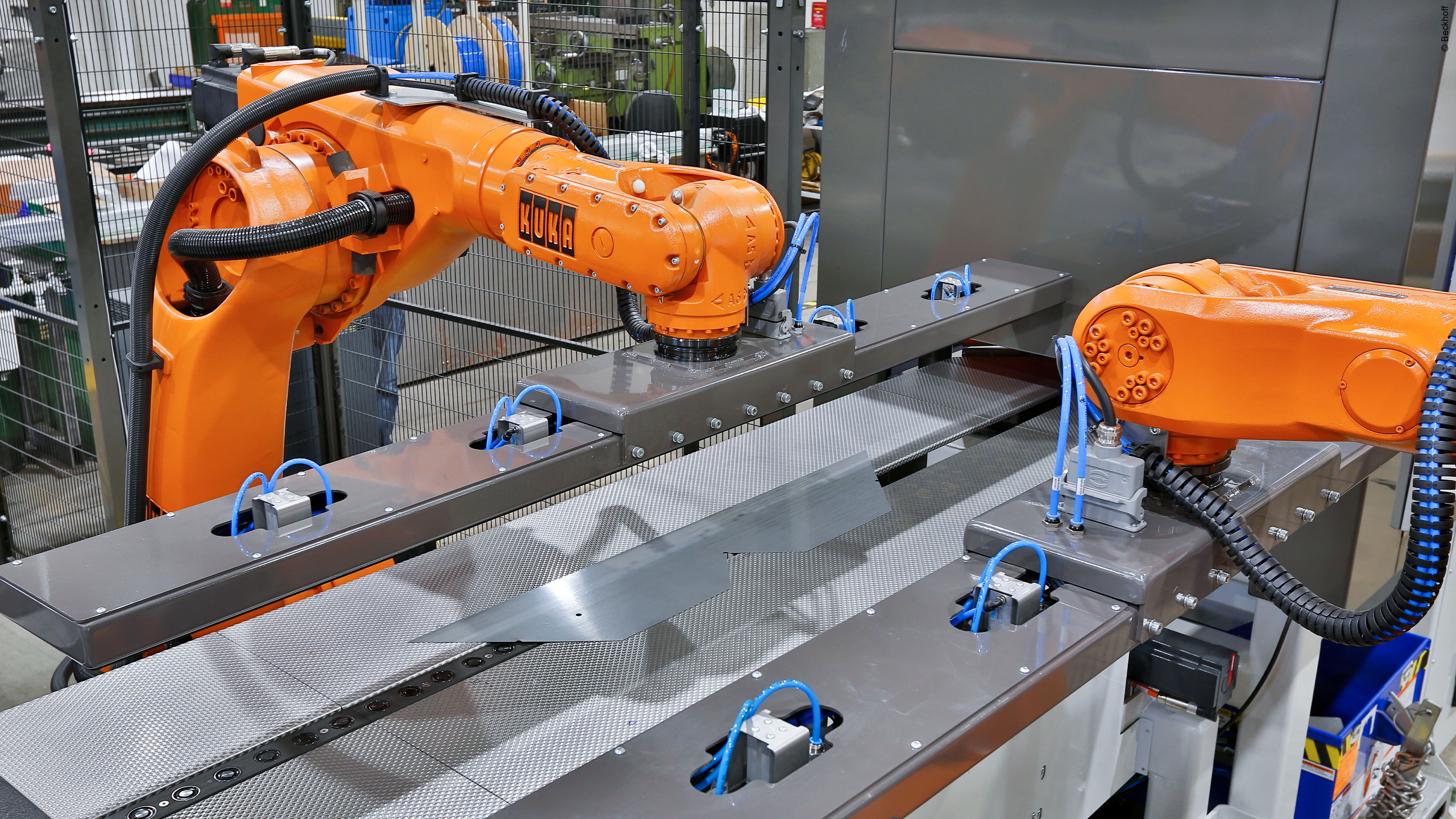 The two articulated KUKA robots stacking the cut laminations can be integrated optimally with PC-based control technology from Beckhoff.  