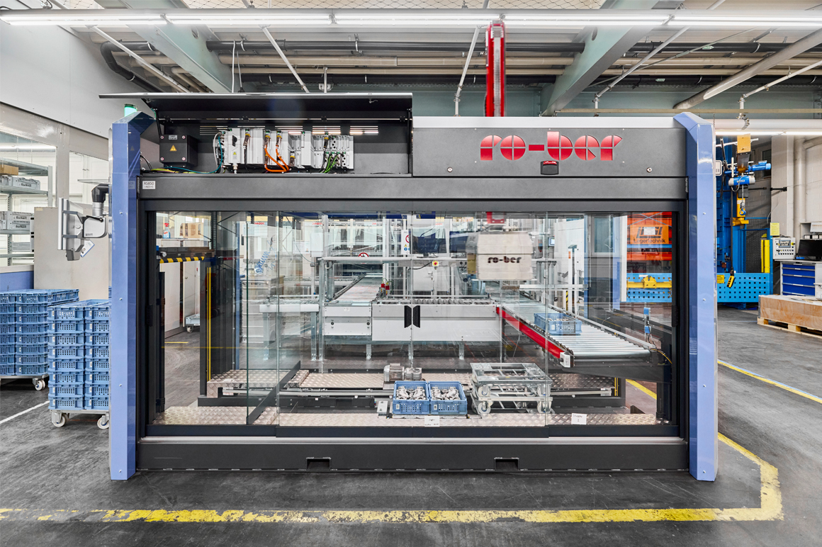 The RO-BER depalletizing cell fits seamlessly into the limited space next to the automated small parts warehouse at Bürkert’s Criesbach, Germany site.